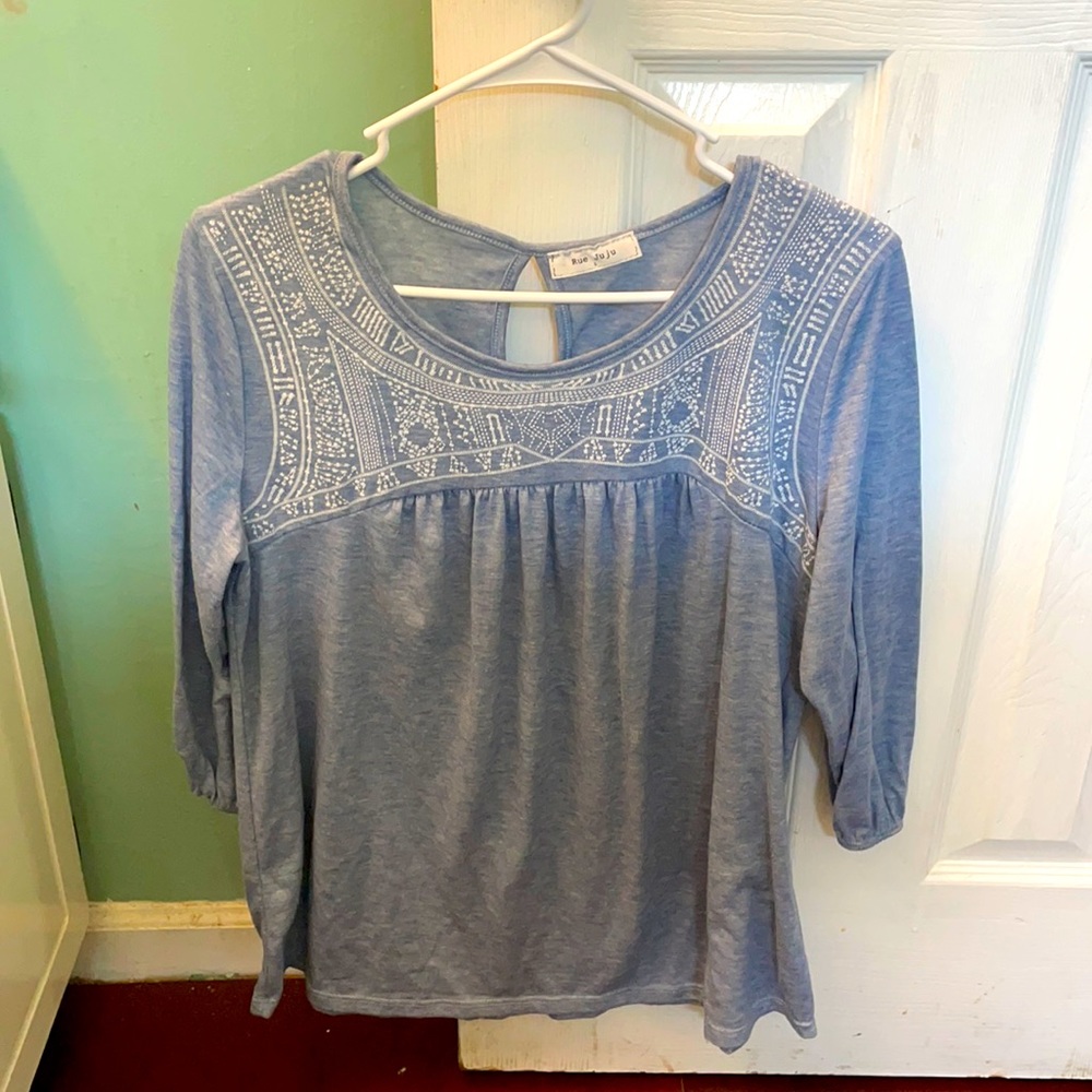 A Blue and white blouse.